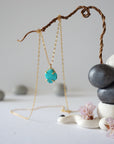 14k gold vermeil turquoise pendant necklace hanging on display showing full length