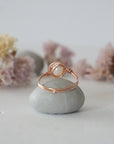 Back view of a minimalist pearl ring crafted in 14k rose gold filled wire