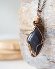 Left angle close-up of blue tiger's eye necklace for men – highlighting unique wire-wrapped artistry, blue tiger's eye, antique bronze copper.