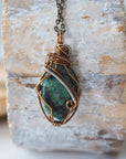 Back view of handcrafted emerald necklace – natural stone and wire wrapping detail, May birthstone pendant by Designs by Nature Gems.