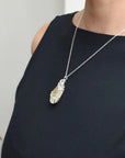 Woman wearing wire wrapped citrine necklace November birthstone pendant sterling silver jewelry