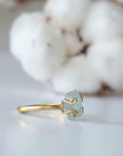 Right angle view of adjustable aquamarine ring, highlighting prong setting and raw gemstone, 14k gold vermeil