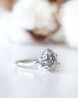 Side angle detail of adjustable raw Herkimer diamond ring in 925 sterling silver artisan setting.