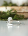 Back view of adjustable ring band in 925 sterling silver showing open adjustable fit and handcrafted finish on rainbow moonstone ring.