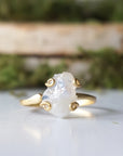 Close-up front view of raw rainbow moonstone stone in artisan 14k gold vermeil adjustable ring setting, June birthstone ring.