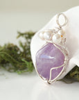 Side angle of handmade amethyst and freshwater pearl pendant necklace, silver wire wrapped jewelry