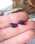 Amethyst stud earrings in hand for size reference, natural dark amethyst, sterling silver posts