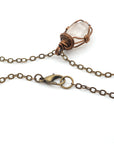 Detail of antique bronze cable chain and lobster clasp closure on handmade Herkimer diamond necklace.