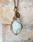 Back angle view of genuine aquamarine necklace, handcrafted wire wrapped jewelry by Designs by Nature Gems.
