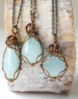 Three genuine aquamarine necklaces showing natural variation in stone size, color, and shape, artisan jewelry by Designs by Nature Gems.
