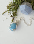 Genuine aquamarine necklace laying flat, handcrafted in sterling silver, Designs by Nature Gems