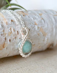 Right side angle of aquamarine necklace for women, artisan wire wrapped, soft silver finish