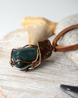Side angle view of natural bloodstone necklace, showing artisan wire wrap detail, by Designs by Nature Gems.