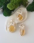 Three silver wire wrapped citrine and freshwater pearl pendants showing natural stone variation, artisan jewelry for women