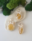 Three silver wire wrapped citrine and freshwater pearl pendants showing natural stone variation, artisan jewelry for women