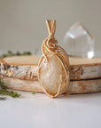 Back view of citrine pendant gold wire wrapped showing artisan craftsmanship November birthstone necklace detail