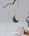 Right angle detail of emerald moon necklace for women with natural faceted emerald and handcrafted 14k gold filled wire wrapping