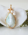 Detailed front angle of jade and freshwater pearl pendant, gold wire wrapped, handcrafted gemstone jewelry