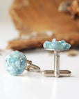 Right side angle of men's aquamarine cufflinks, showing genuine aquamarine stones, white gold finish copper