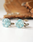 Top view of men's aquamarine cufflinks, multiple genuine aquamarine stones, white gold finish copper