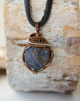 Men's raw sapphire necklace on a genuine black leather cord — antique bronze and dark silver wire wrap, handcrafted crystal jewelry by Designs by Nature Gems