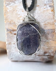 Back view of men's sapphire pendant showing the detail of dark silver wire-wrapping — one-of-a-kind handcrafted crystal jewelry by Designs by Nature Gems