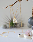 Back angle view of raw Herkimer diamond necklace with minimalist gold vermeil prong setting.