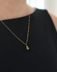 Minimalist peridot necklace for women worn on model — dainty 14k gold filled chain with vivid lime green faceted peridot pendant, handmade August birthstone jewelry by Designs by Nature Gems