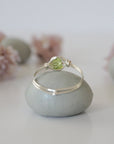 Back view of minimalist silver wire wrapped peridot ring — handcrafted wire band detail, dainty August birthstone crystal ring for women by Designs by Nature Gems
