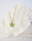 Minimalist raw peridot necklace for women — vivid olive green crystal in gold vermeil four-prong setting on 14k gold filled chain, dainty August birthstone jewelry by Designs by Nature Gems