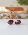 Front detail of natural raw garnet stud earrings with 925 sterling silver posts, minimalist January birthstone earrings
