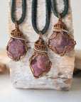 Three natural raw ruby pendants side by side showing unique variation in size, shape, and colour — each one of a kind by nature, men's crystal necklace
