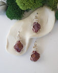 Three natural raw ruby pendants side by side showing unique variation in size, shape, and colour — each one of a kind by nature