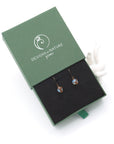 Opal drop earrings presented in a branded gift box, ready for gifting, with antique bronze copper wire wrapping.