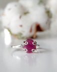Front view of pink ruby adjustable ring showing natural raw ruby stone in curled 925 sterling silver setting — handmade crystal ring for women