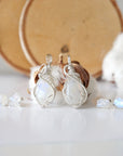 Two rainbow moonstone necklace and earrings sets showing natural variation in moonstone size, shape, and blue flash (June birthstone).