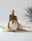 Right angle view of rainbow moonstone pendant showing handcrafted mixed metal wire wrapping detail