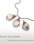 Three rainbow moonstone pendants showing natural variation in size shape and colour in handcrafted artisan jewelry