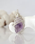Back view of raw amethyst wire wrapped pendant — 925 sterling silver hand-wrapped setting, shows craftsmanship and secure stone hold, handmade in Toronto Canada