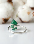 Back view of adjustable sterling silver emerald ring showing ring band and handcrafted setting details
