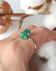 Raw emerald adjustable ring in sterling silver worn on a woman's hand, natural May birthstone ring for women