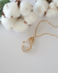 Raw Herkimer diamond necklace in 14k gold filled laying flat. Handcrafted April birthstone jewelry for women by Designs by Nature Gems.