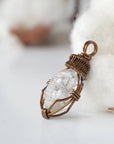 Left angle view of raw Herkimer diamond necklace for women highlighting artisan wire wrapping in antique bronze copper.