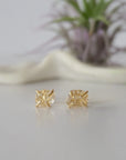 Front view of raw Herkimer diamond stud earrings with minimalist 14k gold vermeil prong setting.