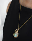 Raw opal necklace in 14k gold filled on a female model. Handcrafted October birthstone jewelry for women by Designs by Nature Gems.