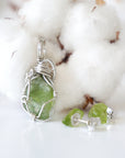 Back view of raw peridot wire wrapped pendant and stud earrings — 925 sterling silver wire weave detail, handcrafted artisan crystal jewelry set, August birthstone
