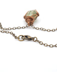 Antique bronze lobster clasp detail — raw peridot necklace closure, nickel-free handmade crystal jewelry by Designs by Nature Gems