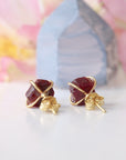 Back view of raw ruby prong stud earrings showing 14k gold vermeil posts and butterfly closure — natural crystal earrings quality detail