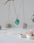 Back view of sterling silver turquoise necklace showing claw prong setting detail
