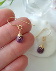 Ruby drop earrings in hand for size reference, genuine faceted ruby, 14k gold filled